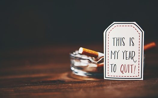 an image of cigarettes in an ashtray with a slogan